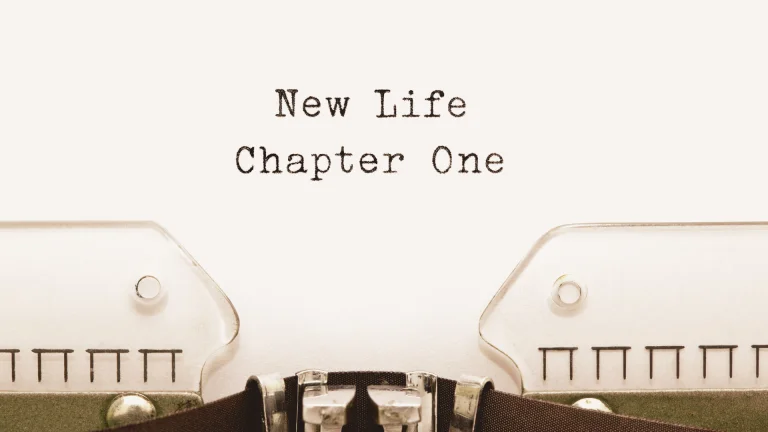 Typewriter text reading New Life Chapter One, representing a new beginning