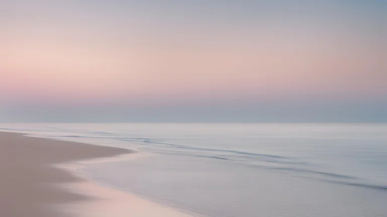 Calm beach at sunrise, representing quiet reflection and emotional wellbeing